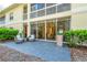 Condo patio with outdoor seating and lush landscaping at 3608 54Th W Dr # 102, Bradenton, FL 34210