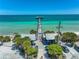 Anna Maria City Pier view featuring ocean views with people enjoying fishing and beach activities under a clear blue sky at 3608 54Th W Dr # 102, Bradenton, FL 34210