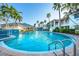 Resort-style pool surrounded by beautiful landscaping and comfortable lounge chairs at 3608 54Th W Dr # 102, Bradenton, FL 34210