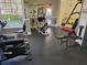 Community gym featuring updated exercise equipment and machines near a window with natural light at 4152 Central Sarasota Pkwy # 724, Sarasota, FL 34238