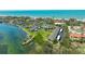 Aerial view of the community with a waterfront view and community pool at 4234 Gulf Of Mexico Dr # Q2, Longboat Key, FL 34228