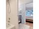 Bathroom featuring a shower and a sink with storage, with access to the main bedroom at 4234 Gulf Of Mexico Dr # Q2, Longboat Key, FL 34228