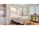 This bedroom features a murphy bed, lovely decor, and hardwood flooring at 4234 Gulf Of Mexico Dr # Q2, Longboat Key, FL 34228