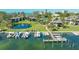 Aerial view of boat docks and condos with a central pond and fountain at 4234 Gulf Of Mexico Dr # Q2, Longboat Key, FL 34228