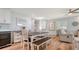 Dining area with a wooden table and benches is adjacent to the kitchen, perfect for gatherings at 4234 Gulf Of Mexico Dr # Q2, Longboat Key, FL 34228