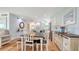 Open-concept dining area adjacent to the kitchen with modern furnishings and plenty of natural light at 4234 Gulf Of Mexico Dr # Q2, Longboat Key, FL 34228