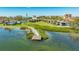 Exterior view of waterfront condos with a dock and lush landscaping in the area at 4234 Gulf Of Mexico Dr # Q2, Longboat Key, FL 34228