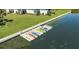 Aerial shot of kayak dock with a collection of colorful kayaks ready for use at 4234 Gulf Of Mexico Dr # Q2, Longboat Key, FL 34228