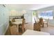 Light and airy kitchen with white cabinets, stainless steel appliances, and seating at 4234 Gulf Of Mexico Dr # Q2, Longboat Key, FL 34228