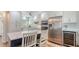 Modern kitchen featuring white cabinets, stainless steel appliances, a center island, and a bright, airy feel at 4234 Gulf Of Mexico Dr # Q2, Longboat Key, FL 34228