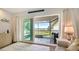 Bright living room with sliding glass doors leading to a screened lanai overlooking the water at 4234 Gulf Of Mexico Dr # Q2, Longboat Key, FL 34228