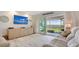Comfortable living room featuring a wall-mounted TV and scenic views at 4234 Gulf Of Mexico Dr # Q2, Longboat Key, FL 34228