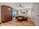 Relaxing main bedroom with a ceiling fan, armoire, and access to the lanai at 4234 Gulf Of Mexico Dr # Q2, Longboat Key, FL 34228