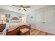 Relaxing main bedroom with a ceiling fan, queen size bed and side tables at 4234 Gulf Of Mexico Dr # Q2, Longboat Key, FL 34228