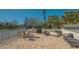 Outdoor patio with grilling area, tables, chairs, and cozy seating near tennis courts at 4234 Gulf Of Mexico Dr # Q2, Longboat Key, FL 34228