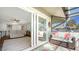Relaxing screened patio with comfortable seating and bright, cheerful decor, accessible from the main living area at 4234 Gulf Of Mexico Dr # Q2, Longboat Key, FL 34228
