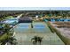 Community amenities including tennis and basketball courts, with a pool and pond, providing a vibrant living experience at 4509 Halls Mill Xing, Ellenton, FL 34222
