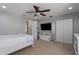 Comfortable bedroom with ceiling fan, ample closet space, and neutral carpet at 4509 Halls Mill Xing, Ellenton, FL 34222