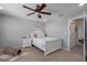 Serene bedroom featuring a white bed, nightstand, and soft neutral decor at 4509 Halls Mill Xing, Ellenton, FL 34222