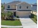 Charming two-story home with well-maintained lawn, two car garage and beautiful landscaping at 4509 Halls Mill Xing, Ellenton, FL 34222