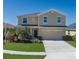 Charming two-story home with well-maintained lawn, two car garage and beautiful landscaping at 4509 Halls Mill Xing, Ellenton, FL 34222