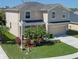 Charming two-story home with well-maintained lawn, two car garage and beautiful landscaping at 4509 Halls Mill Xing, Ellenton, FL 34222