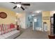 Spacious loft area with colorful walls, comfortable seating, and staircase access at 4509 Halls Mill Xing, Ellenton, FL 34222
