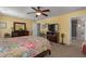 Spacious main bedroom with yellow walls, ceiling fan, and carpeted floor at 4509 Halls Mill Xing, Ellenton, FL 34222