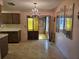Inviting kitchen seamlessly connected to a dining area with charming chandelier at 4546 Webber St, Sarasota, FL 34232