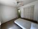 Bright bedroom with a ceiling fan, carpeted floor, and a large closet at 5011 Barrington Cir # 101, Sarasota, FL 34234