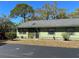 Charming single-story home with a well-maintained yard, lush landscaping, and a convenient carport at 5011 Barrington Cir # 101, Sarasota, FL 34234