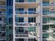 Exterior shot of the building showing private balconies with comfortable seating and lovely views at 540 N Tamiami Trl # 1503, Sarasota, FL 34236