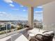 Enjoy the city views from this balcony featuring stylish outdoor seating and decor at 540 N Tamiami Trl # 1503, Sarasota, FL 34236