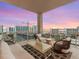 Relaxing balcony featuring comfortable seating and panoramic views of the bay and cityscape at 540 N Tamiami Trl # 1503, Sarasota, FL 34236