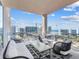 This beautiful condo balcony features comfortable seating and spectacular views of the city and waterfront at 540 N Tamiami Trl # 1503, Sarasota, FL 34236