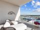 Relax on this spacious balcony with comfortable seating and stunning views at 540 N Tamiami Trl # 1503, Sarasota, FL 34236