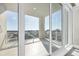 Spacious tiled balcony with sliding glass doors offering a panoramic city view at 540 N Tamiami Trl # 1503, Sarasota, FL 34236