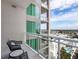Condo balcony with comfortable seating and a stunning view of the city at 540 N Tamiami Trl # 1503, Sarasota, FL 34236
