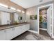 Contemporary bathroom with double vanity, stylish mirrors, and sleek fixtures at 540 N Tamiami Trl # 1503, Sarasota, FL 34236