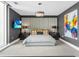 Modern bedroom featuring a padded headboard, stylish chandelier, and contemporary artwork at 540 N Tamiami Trl # 1503, Sarasota, FL 34236