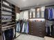 Spacious walk-in closet with custom shelving and hanging rods for organized storage at 540 N Tamiami Trl # 1503, Sarasota, FL 34236