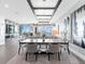 Bright open floor plan featuring water views, a large dining table, and living area at 540 N Tamiami Trl # 1503, Sarasota, FL 34236