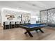 Game room featuring a pool table, bar, and stylish decor at 540 N Tamiami Trl # 1503, Sarasota, FL 34236