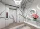 Elegant condo hallway with unique wall art, sleek lighting and elevator access at 540 N Tamiami Trl # 1503, Sarasota, FL 34236