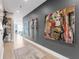 Hallway with art display leading to a living space with lots of natural light at 540 N Tamiami Trl # 1503, Sarasota, FL 34236