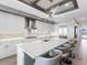 Spacious kitchen with large island, counter seating, stainless appliances, and gas cooktop at 540 N Tamiami Trl # 1503, Sarasota, FL 34236