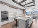 Modern kitchen with white cabinets, stainless steel appliances, and quartz countertops at 540 N Tamiami Trl # 1503, Sarasota, FL 34236