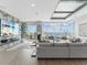 Modern living area with floor-to-ceiling windows and scenic ocean views at 540 N Tamiami Trl # 1503, Sarasota, FL 34236