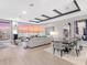 Open-concept living room and dining area boasts stunning views and elegant décor at 540 N Tamiami Trl # 1503, Sarasota, FL 34236