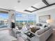 Bright living room showcasing amazing floor to ceiling water views, luxury seating and decor at 540 N Tamiami Trl # 1503, Sarasota, FL 34236